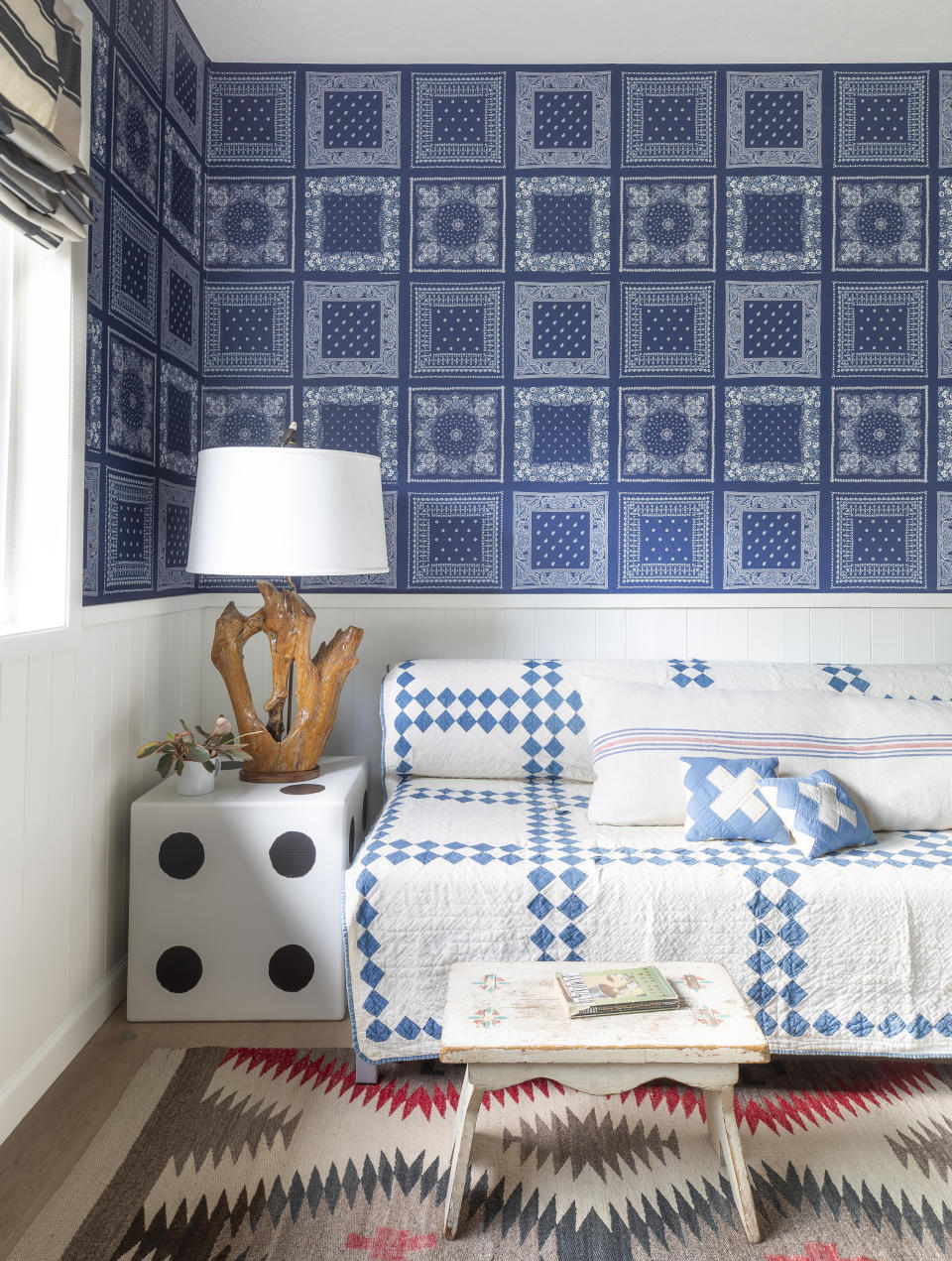 This image released by Portland Oregon-based interior designer Max Humphrey shows a room with a wallpaper design inspired by bandanas. (Christopher Dibble via AP)