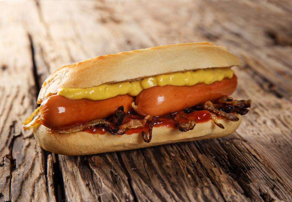 Photo of hotdog with mustard.