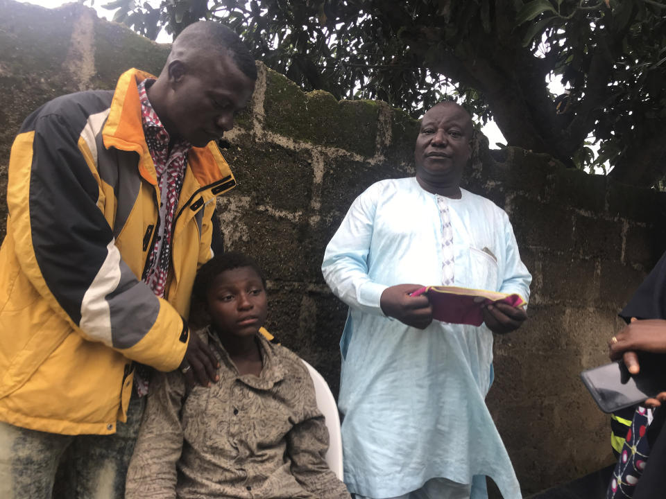 Parents are reunited with released students of the Bethel Baptist High School in Damishi, Nigeria, on Sunday, July 25, 2021. Armed kidnappers in Nigeria have released 28 of the more than 120 students who were abducted at the beginning of July from the Bethel Baptist High School in the northern town of Damishi. Church officials handed those children over to their parents at the school on Sunday. (AP Photo)