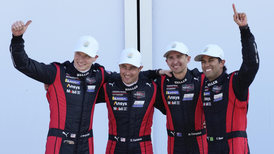 Porsche Penske Motorsport team drivers, from left, Josef Newgarden, Dane Cameron, Matt Campbell, of Australia, and Felipe Nasr, of Brazi,l celebrate in Victory Lane after winning the Rolex 24 hour auto race at Daytona International Speedway, Sunday, Jan. 28, 2024, in Daytona Beach, Fla. (AP Photo/John Raoux)