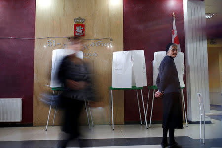 People walk at a polling station located in a public school ahead of the parliamentary elections in Tbilisi, Georgia, October 7, 2016. REUTERS/David Mdzinarishvili