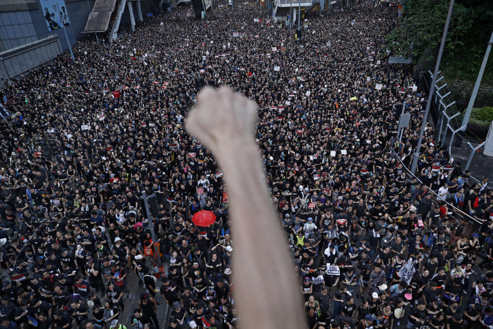 Demonstrators in Hong Kong march on the streets on June 16, 2019, to protest an extradition bill that would allow suspects to be sent for trials in mainland China, which many saw as infringing of Hong Kong's judicial freedoms and other rights that were guaranteed when the former British colony returned to China in 1997. (AP Photo/Vincent Yu)