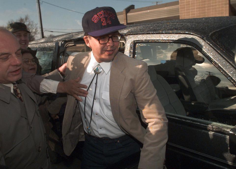 Former Marine Sgt. Clayton Lonetree, accompanied by his attorney Lee Calligaro at left, is hustled from a military prison van to Calligaro's car after making financial transactions at a bank in Leavenworth, Kan., on Feb. 27, 1996.