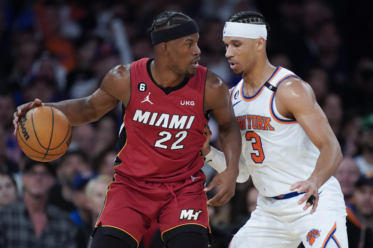 Miami Heat forward Jimmy Butler (22) sets up a play against New York Knicks guard Josh Hart (3) during the second half of Game 1 in the NBA basketball Eastern Conference semifinals playoff series, Sunday, April 30, 2023, in New York. (AP Photo/John Minchillo)