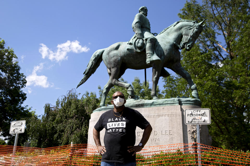 Don Gathers stands in front of a statue depicting Robert E. Lee during a racial justice protest in Charlottesville, Va., on May 30, 2020. (Ryan M. Kelly / AFP via Getty Images file)