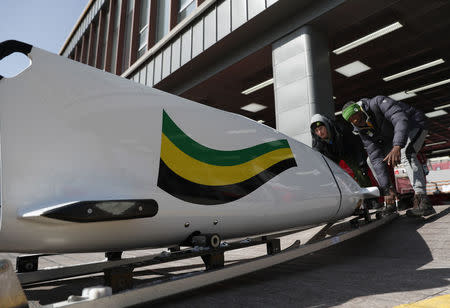 Bobsleigh - Pyeongchang 2018 Winter Olympics - Women's Training - Olympic Sliding Centre - Pyeongchang, South Korea - February 18, 2018 - The sled of Jazmine Fenlator-Victorian and Carrie Russell of Jamaica is transported after a run. REUTERS/Edgar Su