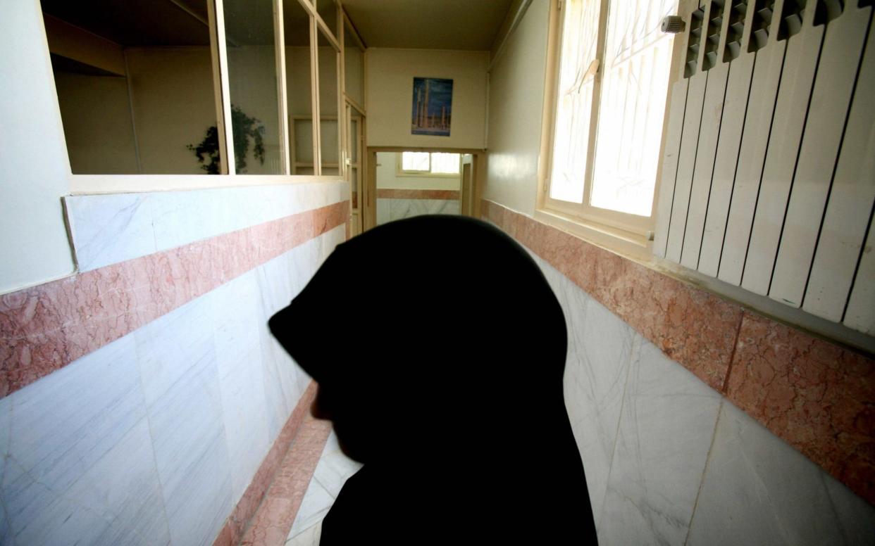 A prison guard stands on a corridor in an Iranian jail, where reports suggest new laws could see prisoners on death row sell their organs  - Reuters