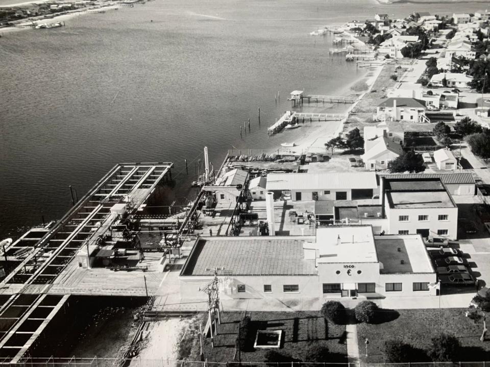 An aerial photograph of Harbor Island in Wrightsville Beach in the 1970s. The LaQue Center and its testing pier is visible in the foreground of the photograph.