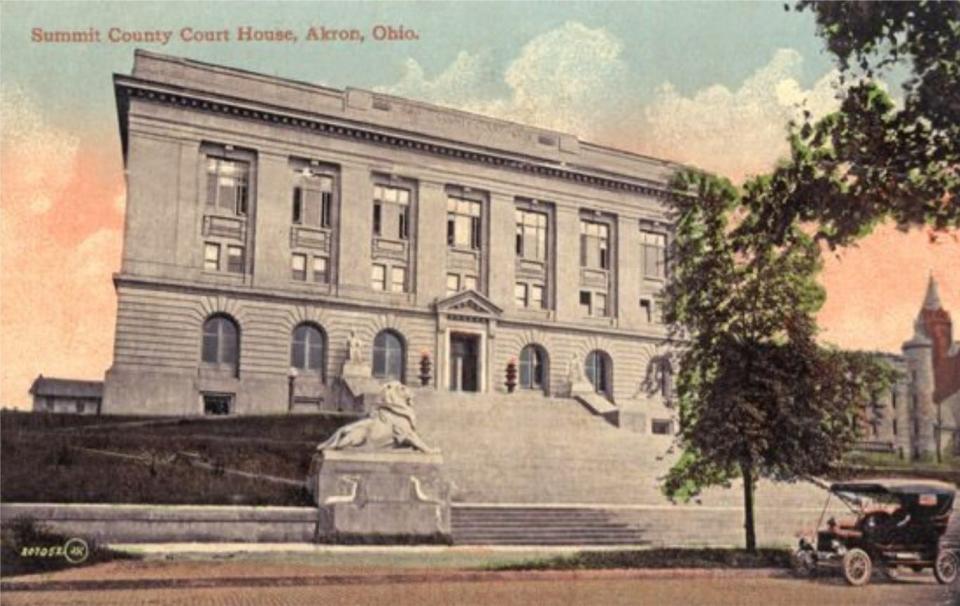 A vintage postcard shows the original steps, flanked by statues, at the Summit County Courthouse on South High Street in downtown Akron. The building was completed in 1908.