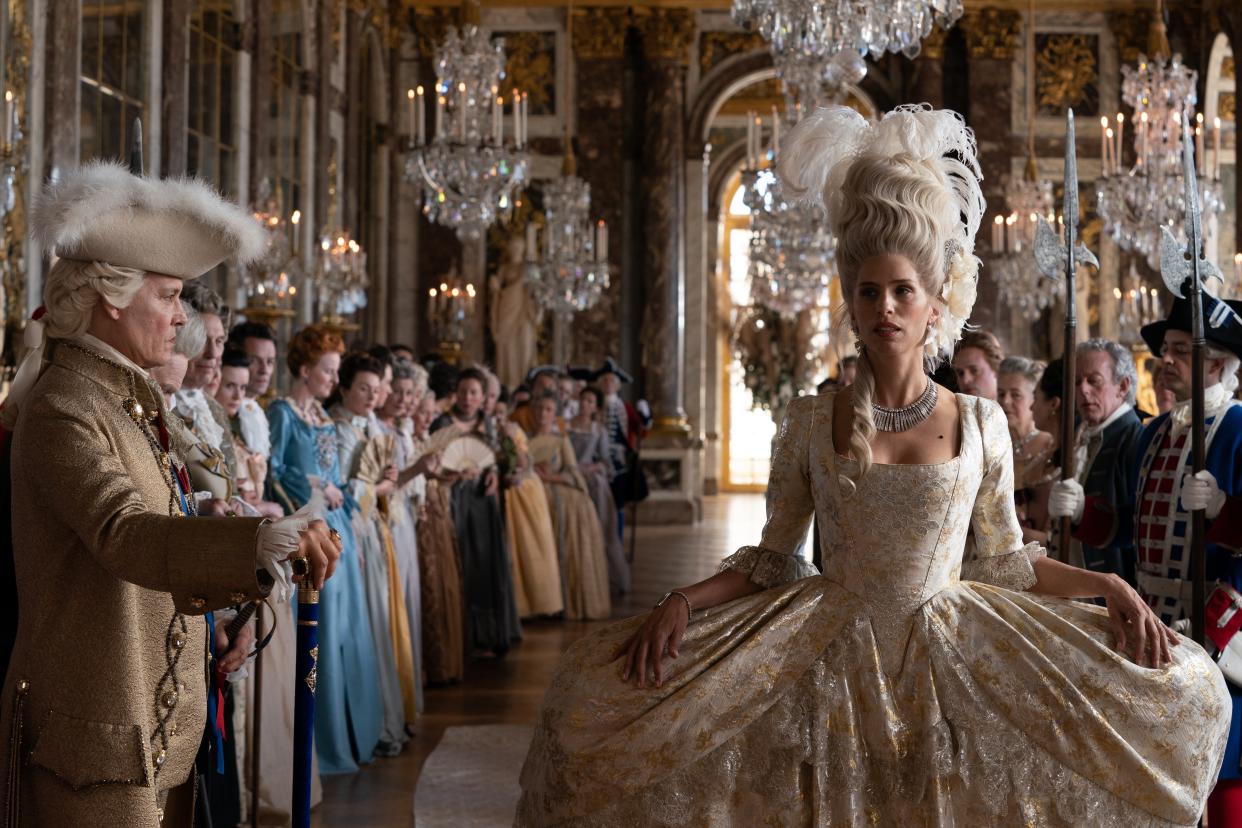 Maïwenn (right) not only stars as the real-life French court bombshell Jeanne du Barry, but she also co-wrote and directed "Jeanne du Barry," which co-stars Johnny Depp (left) as King Louis XV.