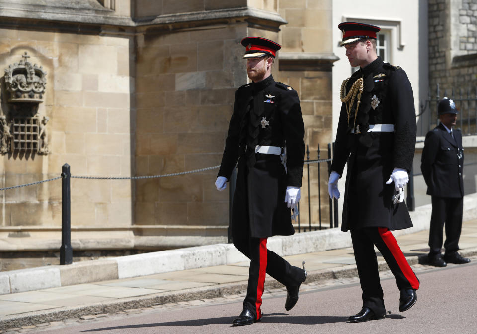 FILE - In this file photo dated Saturday, May 19, 2018, Britain's Prince Harry, left, arrives with his best man Prince William for his wedding ceremony to Meghan Markle at St. George's Chapel in Windsor Castle in Windsor, England. When Prince Harry attends Prince Philip’s funeral on Saturday April 17, many be watching for signs of reconciliation between Prince Harry and his family, especially with his elder brother Prince William. (AP Photo/Alastair Grant, FILE)