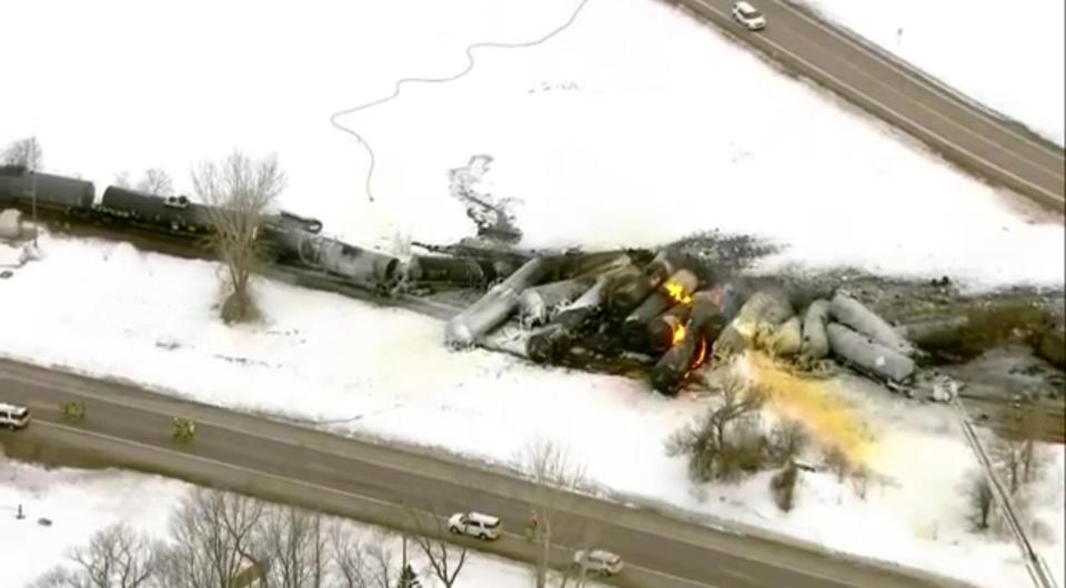 This photo provided KSTP,  emergency personnel respond to the scene of a train derailment early Thursday, March 30, 2023 in Raymond, Min.  A train hauling ethanol and corn syrup derailed and caught fire and nearby residents were ordered to evacuate their homes, authorities said.