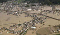 <p>This photo shows an submerged housing area in Kurashiki, Okayama prefecture, western Japan, July 9, 2018. People prepared for risky search and cleanup efforts in southwestern Japan on Monday, where several days of heavy rainfall had set off flooding and landslides in a widespread area. (Photo: Kyodo News via AP) </p>