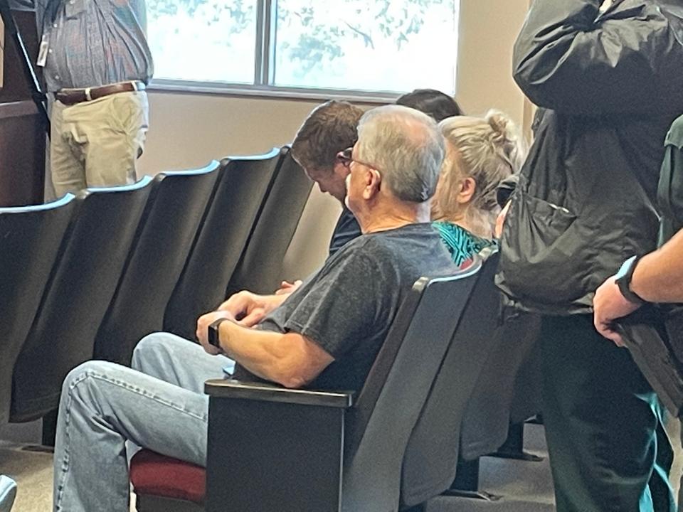 Richard Bowers and his family listen to the verdict from the clerk on Thursday during the Michael Wayne Jones trial.