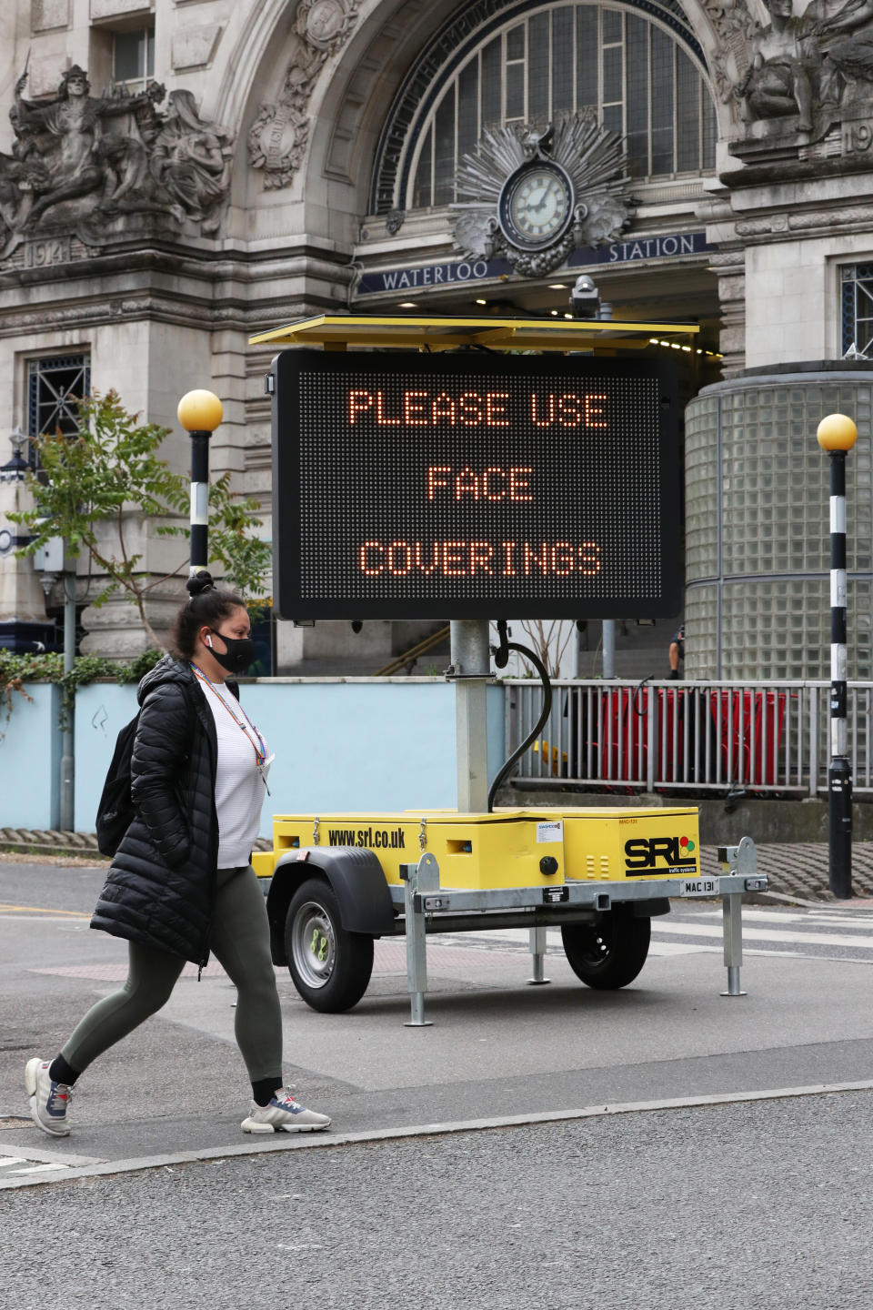 A sign asking people to use face coverings outside Waterloo station in London, following the announcement that wearing a face covering will be mandatory for passengers on public transport in England from June 15. (Photo by Jonathan Brady/PA Images via Getty Images)