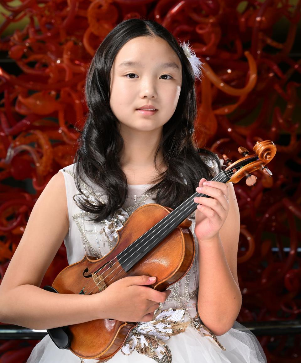 Deann Huang, violinist, poses for photos for the 2023 Salute to Youth Portraits at Abravanel Hall in Salt Lake City on Wednesday, Oct. 4, 2023. | Scott G Winterton, Deseret News