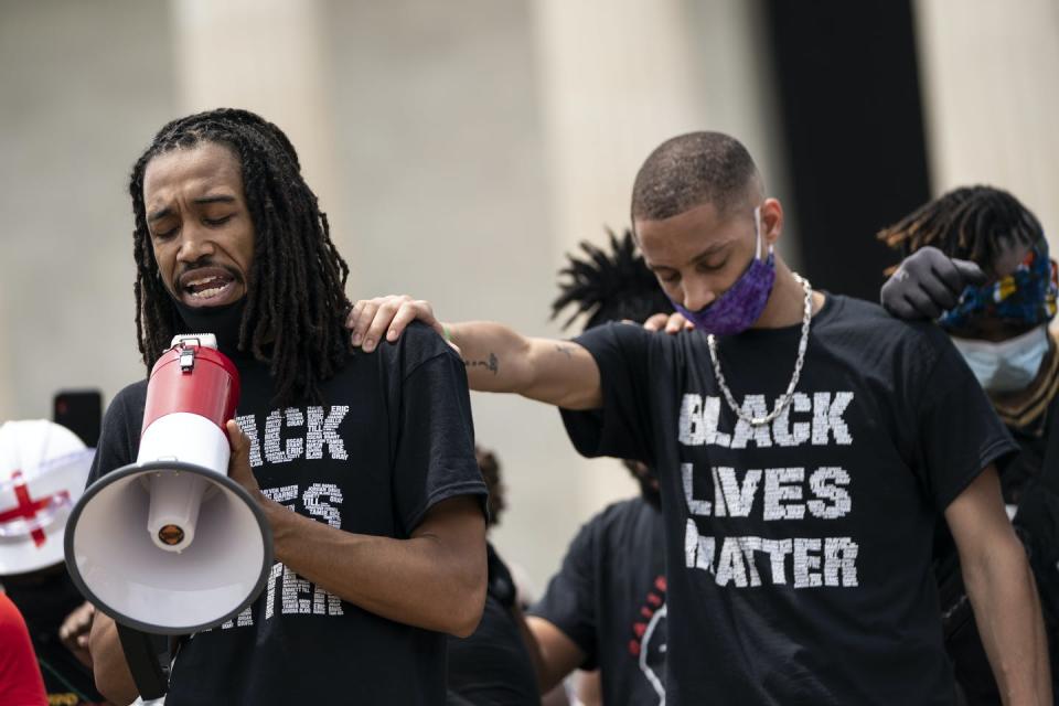 <span class="caption">Black Lives Matter protesters pray near the Lincoln Memorial in Washington D.C.</span> <span class="attribution"><a class="link " href="https://www.gettyimages.com/detail/news-photo/demonstrators-pray-near-the-lincoln-memorial-while-news-photo/1218014301?adppopup=true" rel="nofollow noopener" target="_blank" data-ylk="slk:Drew Angerer/Getty Images;elm:context_link;itc:0;sec:content-canvas">Drew Angerer/Getty Images</a></span>