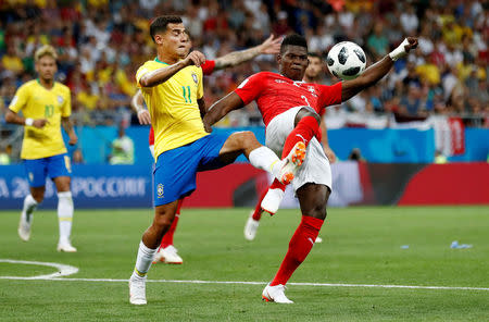 Soccer Football - World Cup - Group E - Brazil vs Switzerland - Rostov Arena, Rostov-on-Don, Russia - June 17, 2018 Brazil's Philippe Coutinho in action with Switzerland's Breel Embolo REUTERS/Damir Sagolj