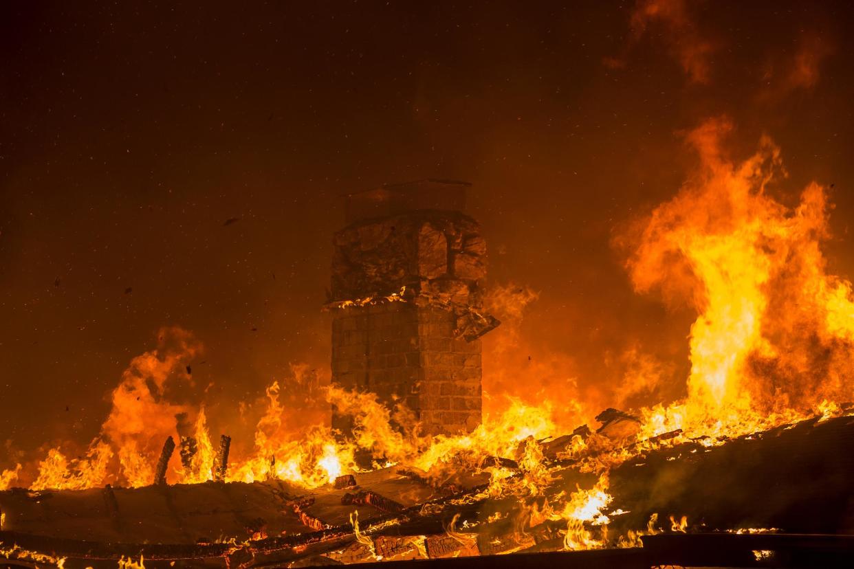A house burns during the Woolsey Fire on November 9, 2018 in Malibu, California: David McNew/Getty Images
