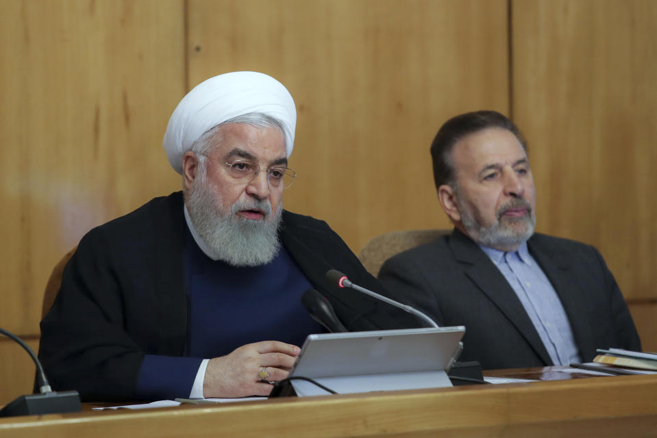 In this photo released by the office of the Iranian Presidency, President Hassan Rouhani speaks in a cabinet meeting in Tehran, Iran, Wednesday, July 24, 2019. President Hassan Rouhani suggested on Wednesday that Iran might release a U.K.-flagged ship if Britain takes similar steps to release an Iranian oil tanker seized by the British Royal Navy off Gibraltar earlier this month. (Iranian Presidency Office via AP)