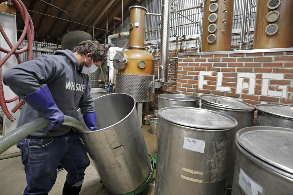 Owner and distiller Brian Ferguson loads a batch of alcohol into a still while making hand sanitizer at the Flag Hill Distillery in Lee, New Hampshire, on May 8. The distillery, which usually produces whisky, rum and vodka, temporarily suspended normal operations to manufacture hand sanitizer. (Photo: ASSOCIATED PRESS)