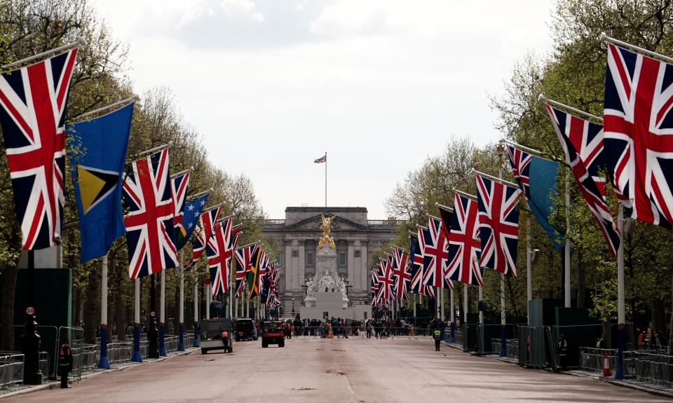 Union flags hang from the street furniture outside Buckingham Palace on the Mall, London, ahead of the coronation of King Charles III on Saturday May 6. Picture date: Monday May 1, 2023.