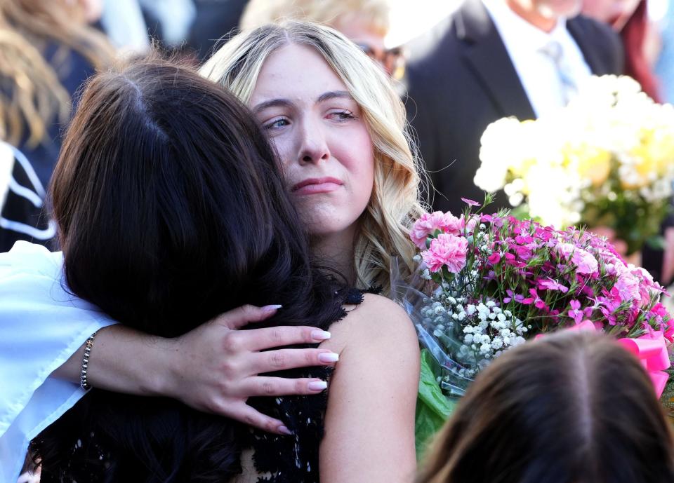 Ella Coleman, a member of La Reina High School's class of 2024, gets emotional after the final commencement at the Thousand Oaks campus on Friday.