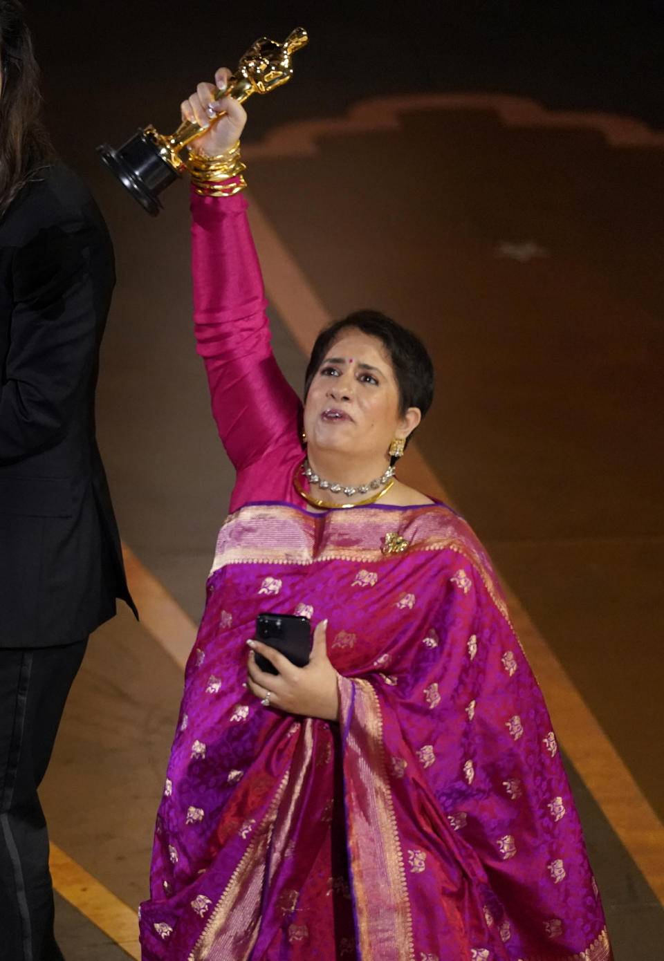 Guneet Monga accepts the award for best documentary short film for "The Elephant Whisperer" at the Oscars on Sunday, March 12, 2023, at the Dolby Theatre in Los Angeles. (AP Photo/Chris Pizzello)