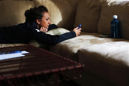 Fifteen year-old Sarah Steenhuysen rests at her home in Rehobeth, Massachusetts October 25, 2013 before going to watch her high school teammates play soccer. REUTERS/Brian Snyder