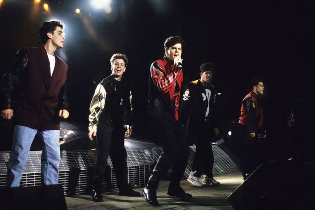 <p>Kevin Mazur/Wireimage</p> Jonathan Knight, Joey McIntyre, Jordan Knight, Donnie Wahlberg and Donnie Wood of New Kids On The Block perform during a 1990 concert.