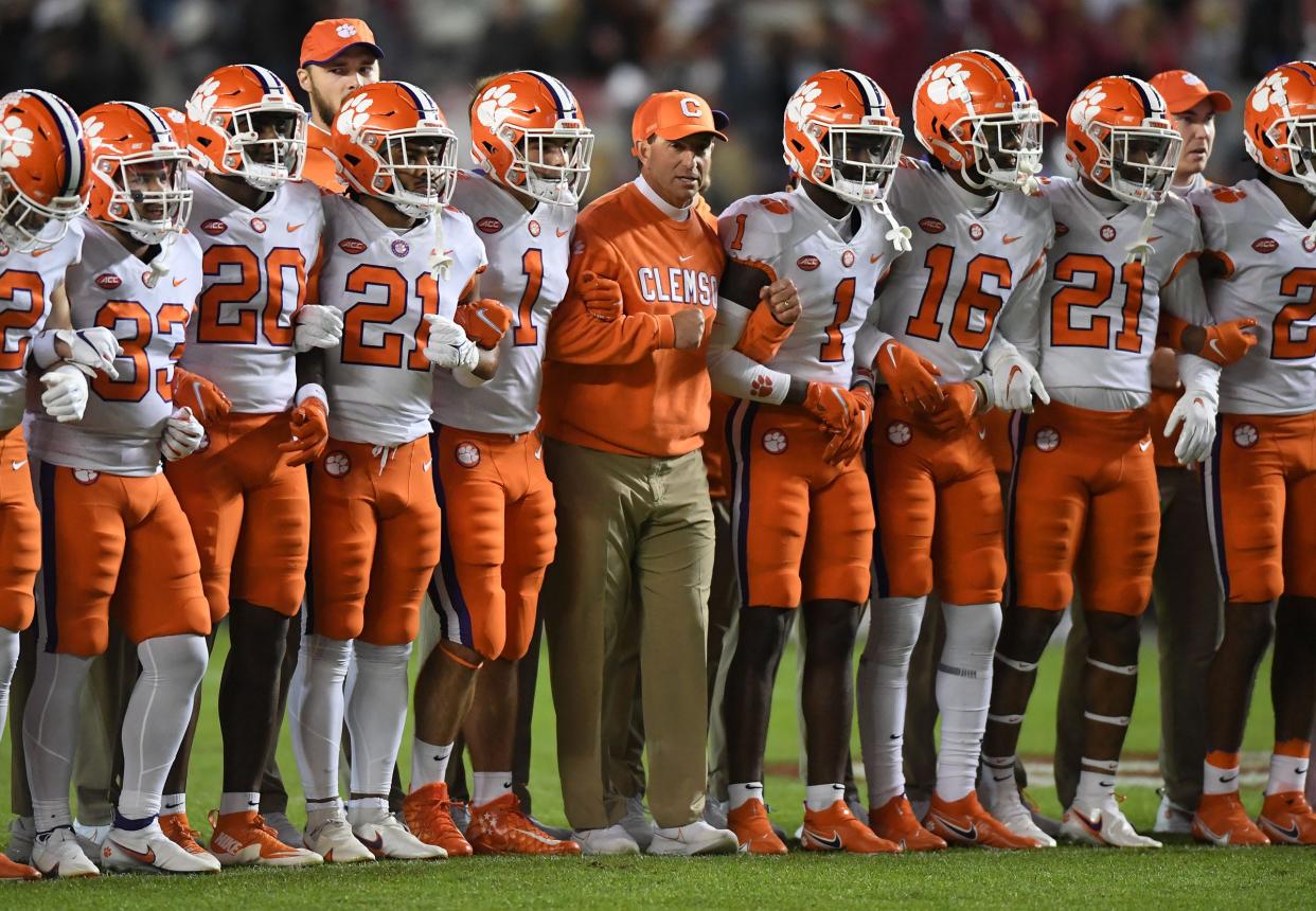 Clemson head coach Dabo Swinney with players for the Walk of Champions before the game at Williams Brice Stadium in Columbia, South Carolina Saturday, November 27, 2021.