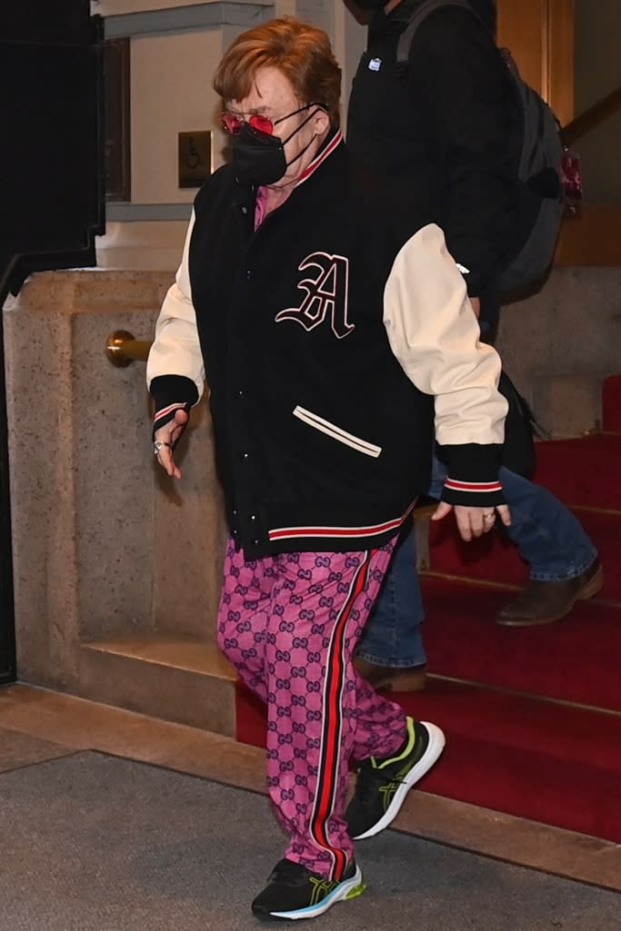 Elton John Nails High-Low Dressing in Gucci Sweatpants & Asics Sneakers