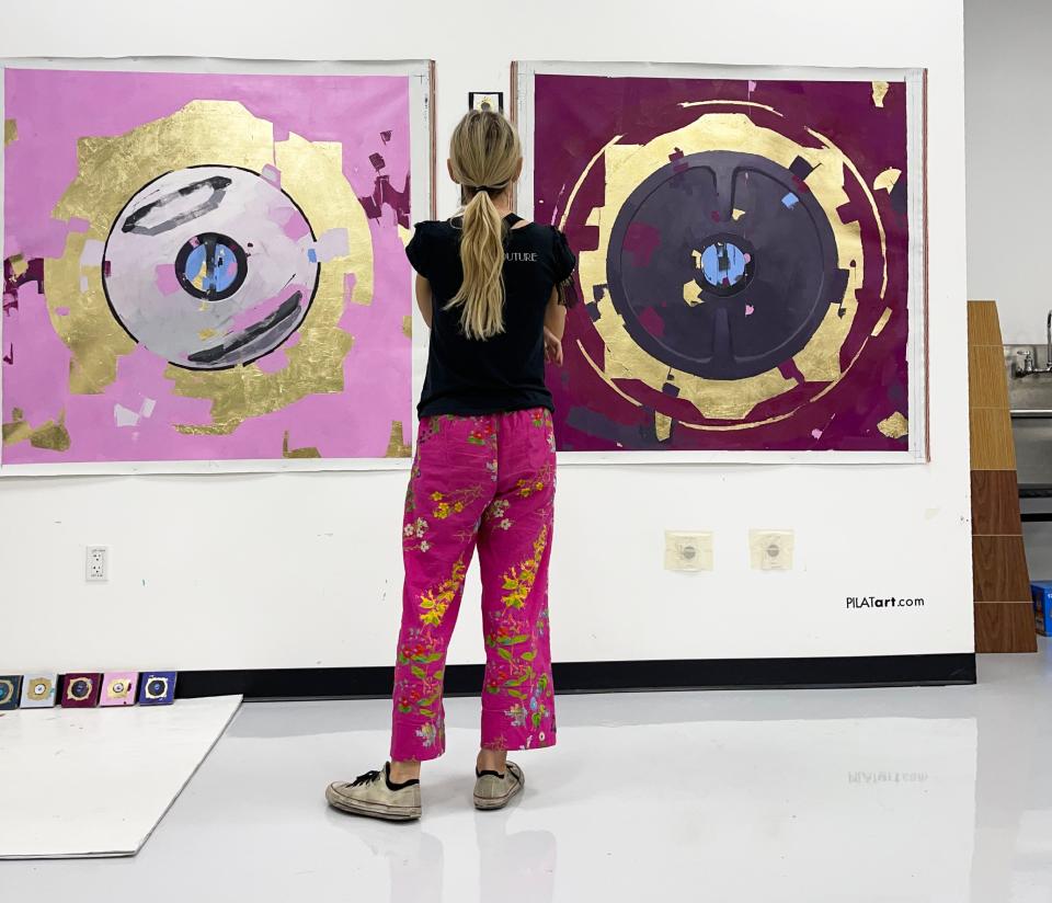 Pilat's artwork from her residency at SpaceX - one pink painting and one maroon