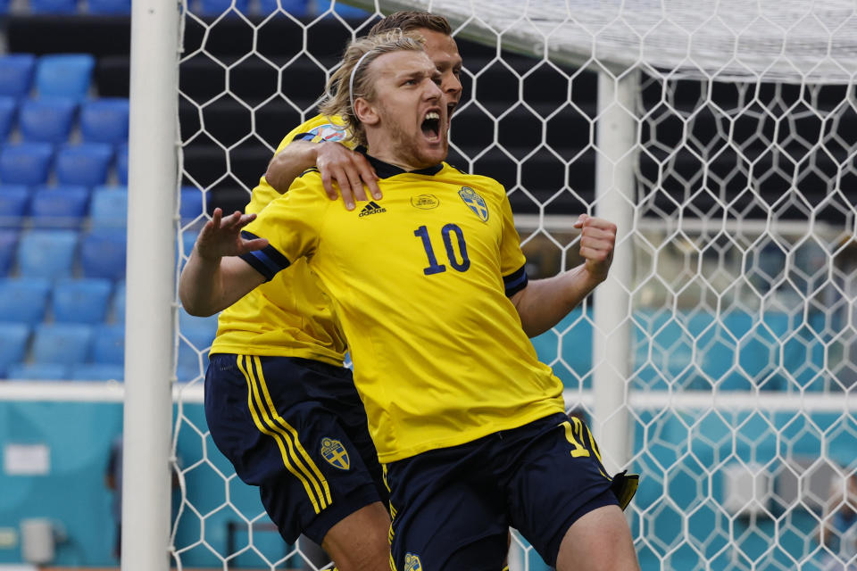 Sweden's Emil Forsberg celebrates after scoring his side's opening goal during the Euro 2020 soccer championship group E match between Sweden and Slovakia, at the Saint Petersburg stadium, in Saint Petersburg, Russia, Friday, June 18, 2021. (Anatoly Maltsev, Pool via AP)