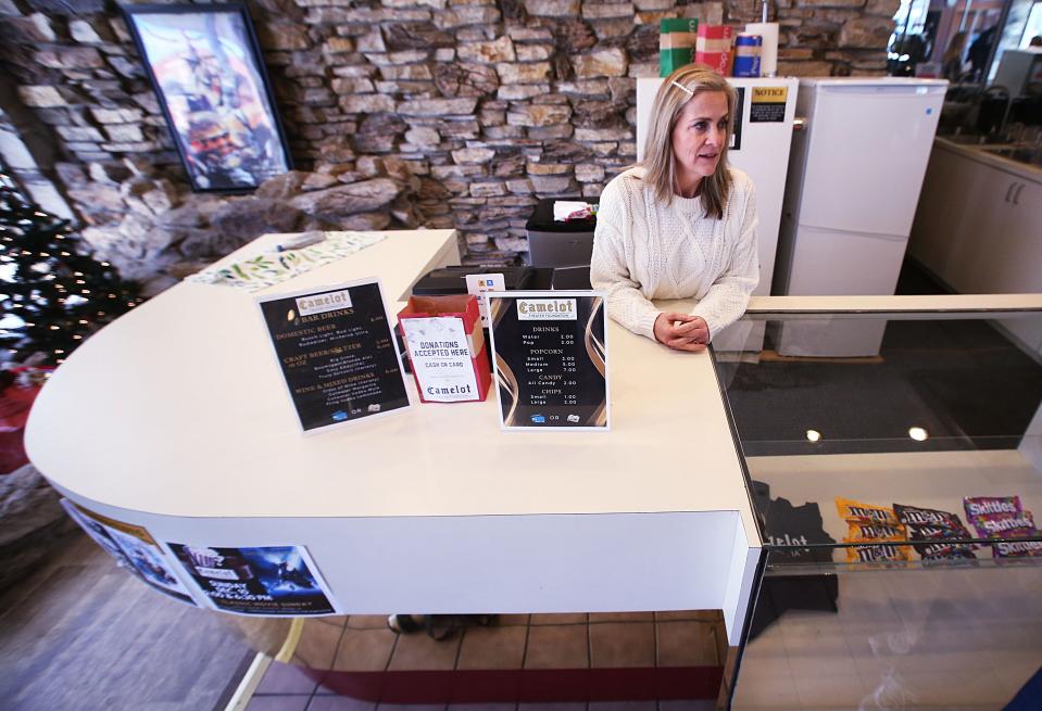 Melissa Sly, president of the Camelot Theater Foundation, talks about plans to renovate the historic theater during a tour in downtown Nevada, Iowa.