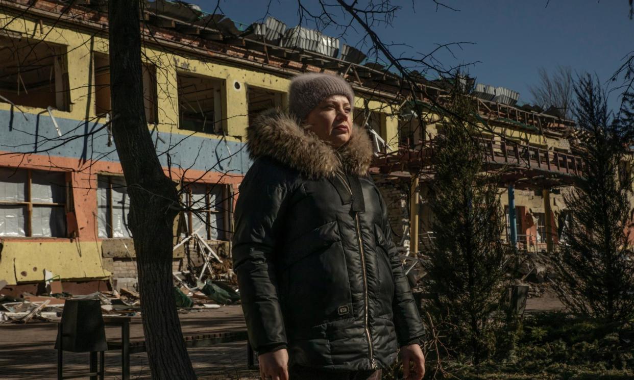 <span>Maryna Halvoronska, mayor of Novoselivka village. Behind her is a school destroyed by Russian bombing.</span><span>Photograph: Alessio Mamo/The Guardian</span>