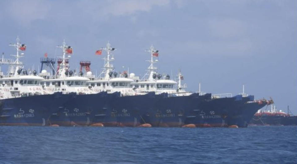 In this March 7, 2021, photo provided by the Philippine Coast Guard/National Task Force-West Philippine Sea, some of the 220 Chinese vessels are seen moored at Whitsun Reef, South China Sea. The Philippine government expressed concern after spotting more than 200 Chinese fishing vessels it believed were crewed by militias at a reef claimed by both countries in the South China Sea, but it did not immediately lodge a protest. (Philippine Coast Guard/National Task Force-West Philippine Sea via AP)