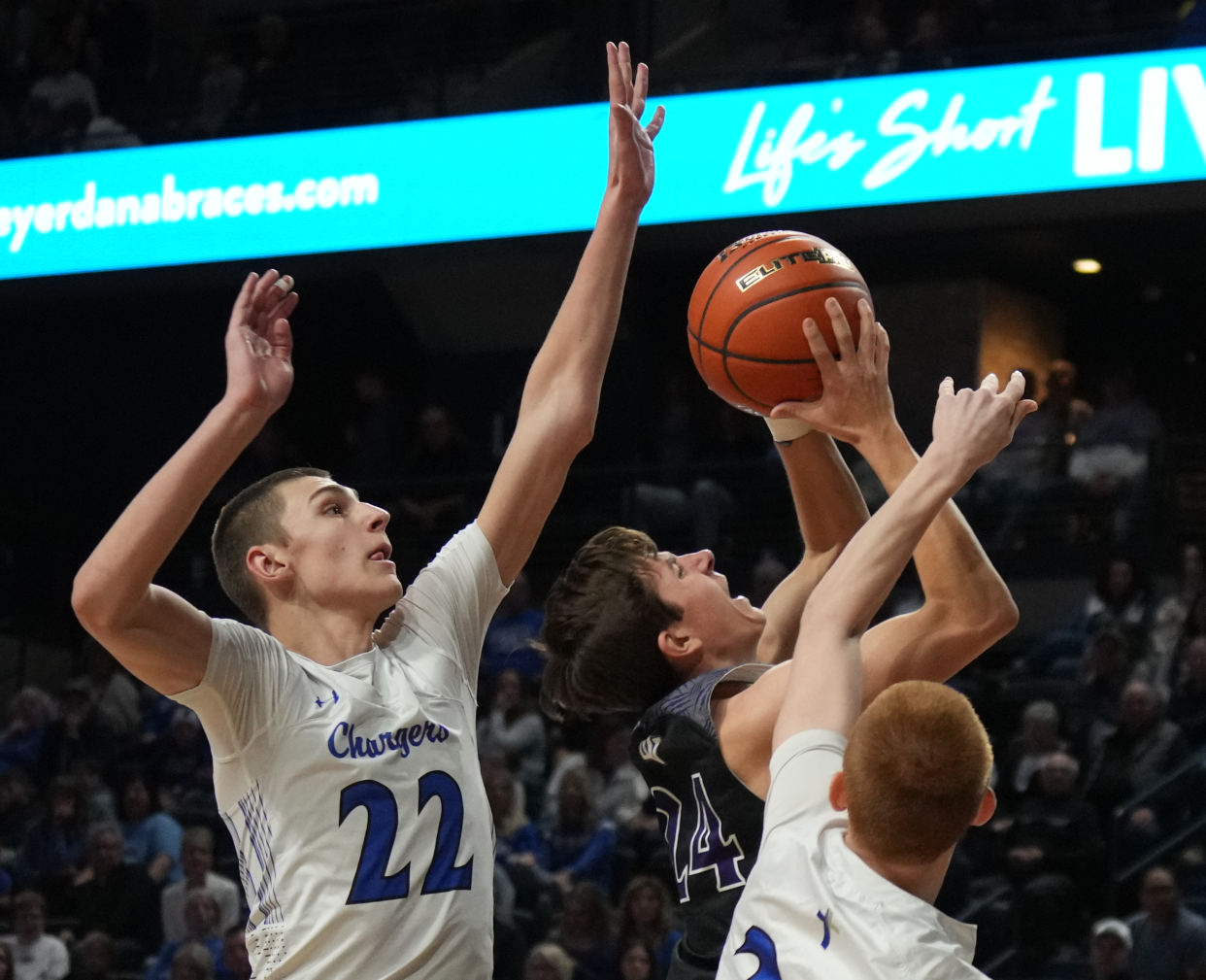 Sioux Falls Christian's Griffen Goodbary (22) goes for the block against Dakota Valley's Logan Collette during their semifinal game in the state Class A boys basketball tournament on Friday, March 15, 2024 in the Summit Arena at The Monument in Rapid CIty.