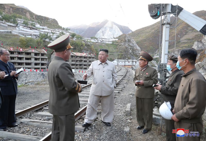 North Korean leader Kim Jong Un inspects a damage recovery site affected by heavy rains and winds caused by recent typhoons, in Geomdeok district, South Hamgyong