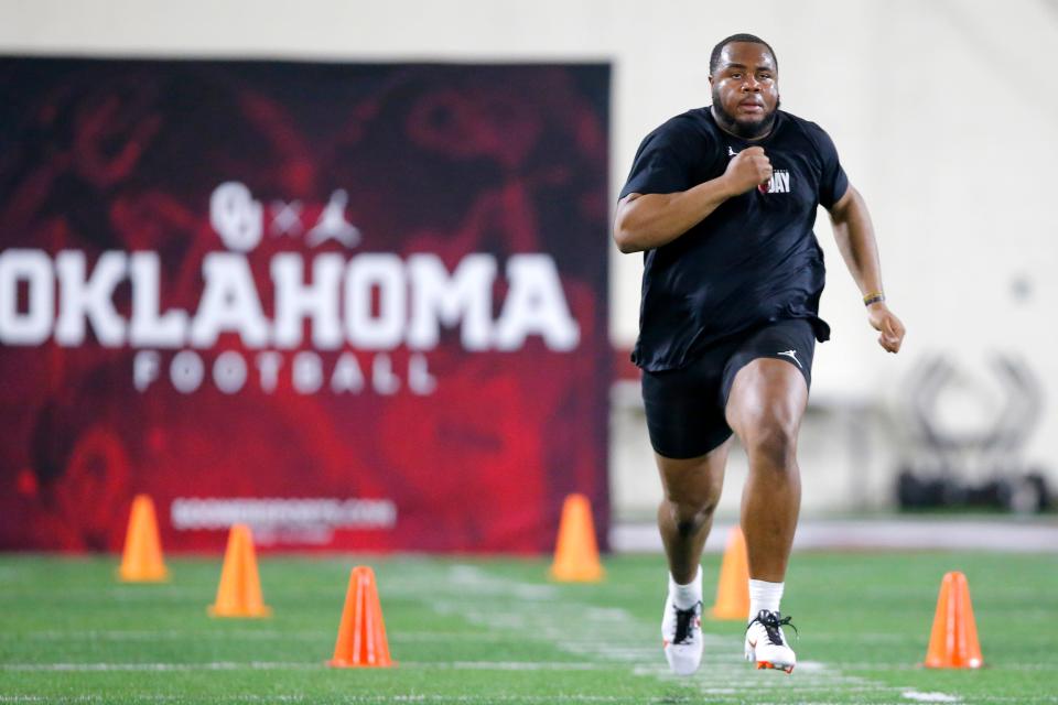 Tyrese Robinson runs the 40-yard dash during the University of Oklahoma Sooners football Pro Day  inside the Everest Training Center in Norman, Okla., Wednesday, March 9, 2022. 