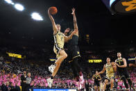 Purdue guard Fletcher Loyer (2) drives on Michigan forward Tarris Reed Jr. (32) in the first half of an NCAA college basketball game in Ann Arbor, Mich., Thursday, Jan. 26, 2023. (AP Photo/Paul Sancya)