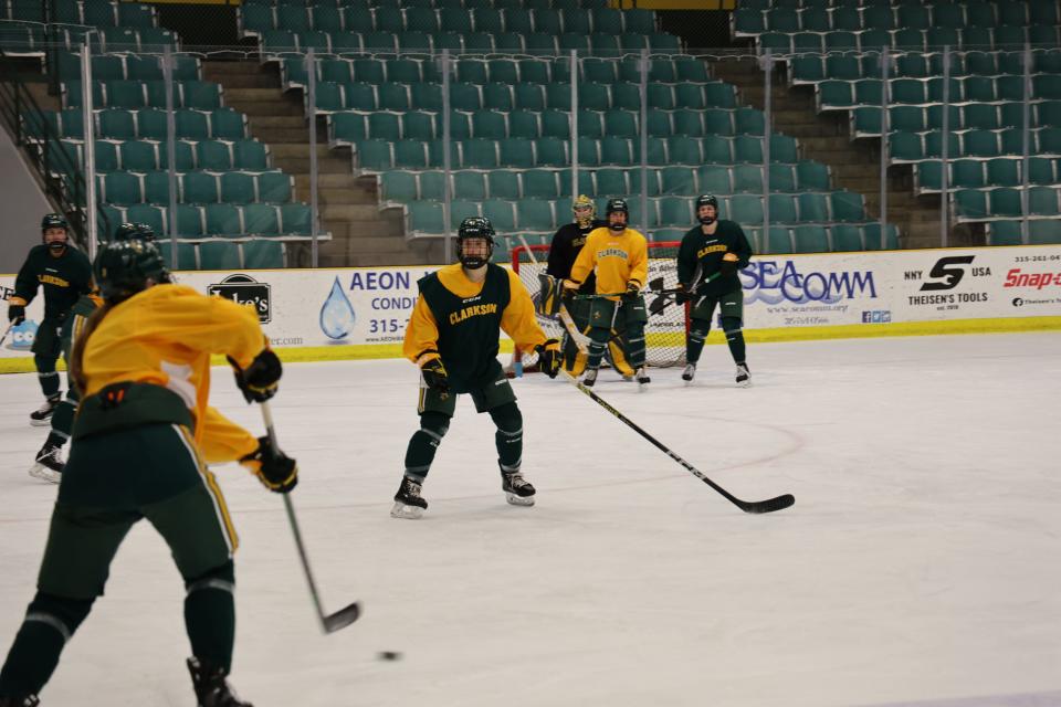 Framingham's Ashyln Ham, center defending, practices with the Clarkson women's hockey team ahead of the Frozen Four this Friday in Durham, New Hampshire. The Golden Knights will face No. 1 Ohio State at 4 p.m. Friday.