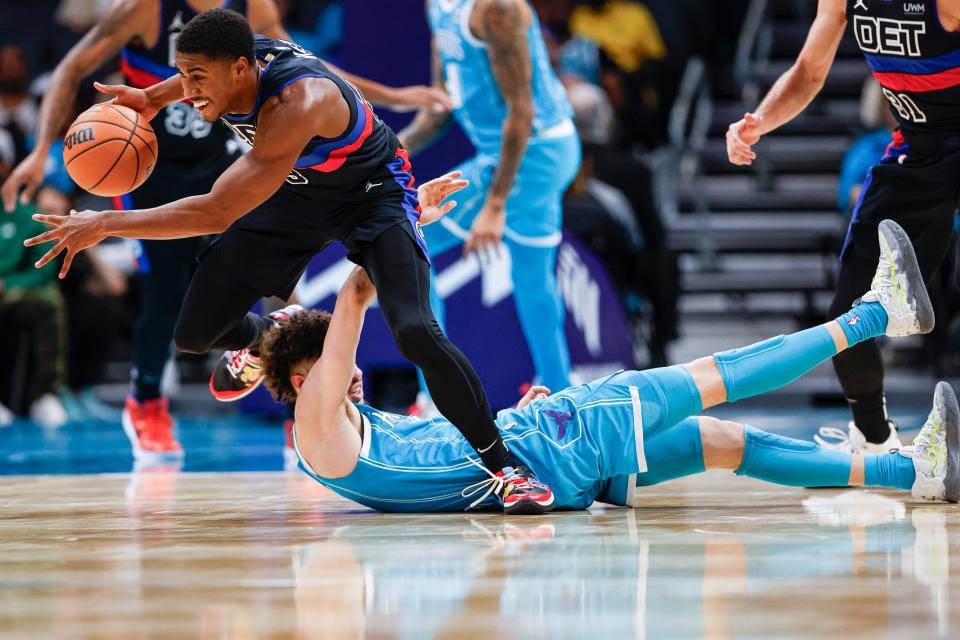 Detroit Pistons guard Jaden Ivey, top left, pushes the ball upcourt after stealing it from Charlotte Hornets guard LaMelo Ball, bottom, during the first quarter at the Spectrum Center in Charlotte, North Carolina, on Friday, Oct. 27, 2023.