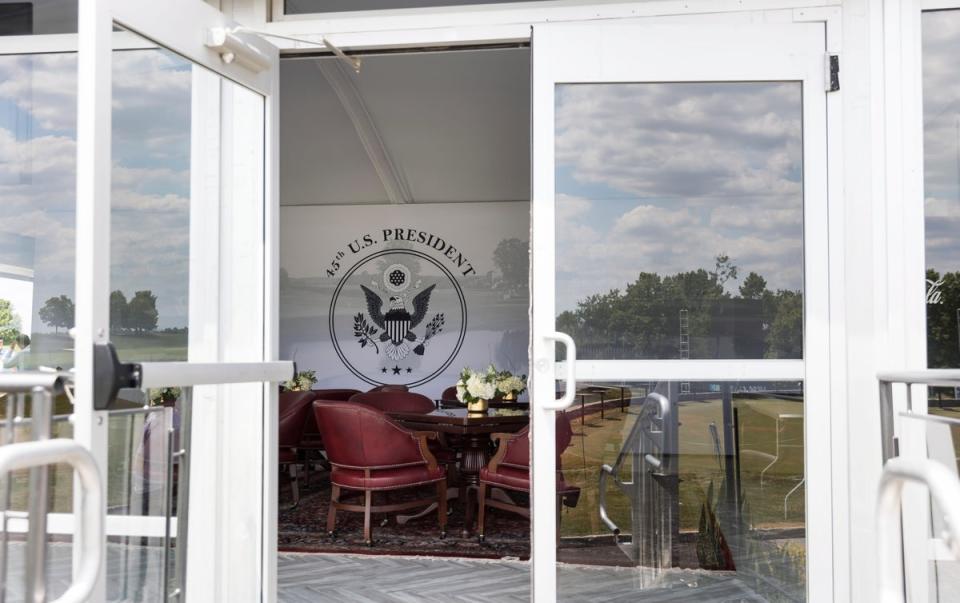 A viewing room in a tent at the 18th green with the US Presidential Seal at the LIV Golf Bedminster (EPA)