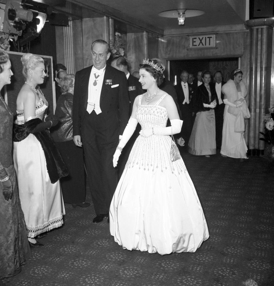 The Queen wearing the same Peau De Soie taffeta dress by Norman Hartnell that was worn by Princess Beatrice at her wedding. (PA Images)