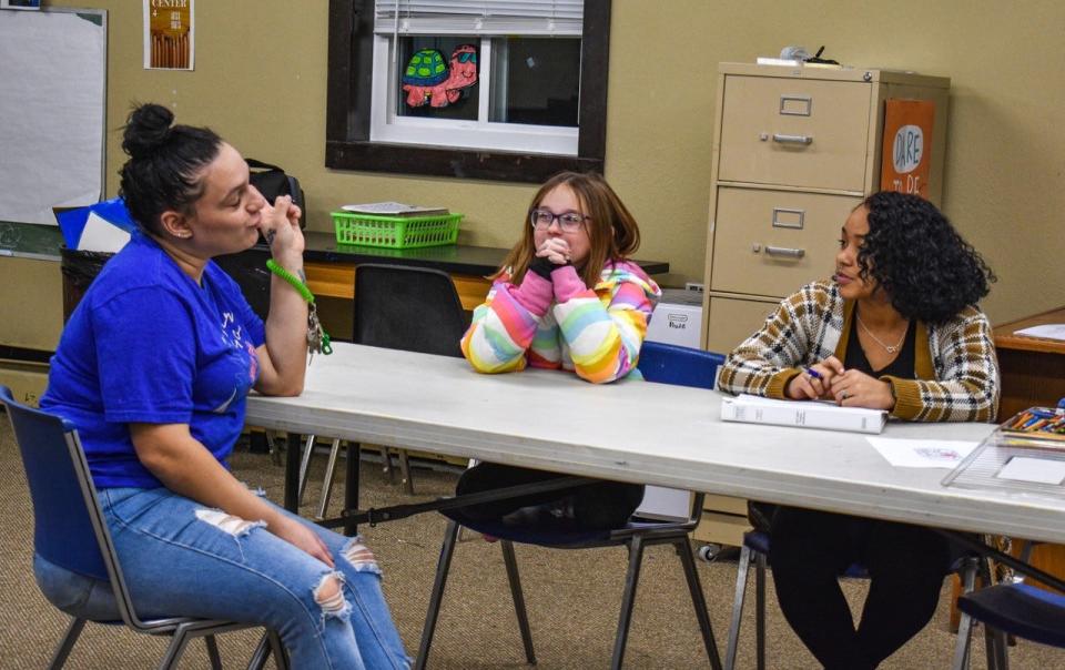 Camp Director Kayla Melendez, left, talks with camper Olyvia Young and Instructor Amya Magee on the first day of Fashion Camp.