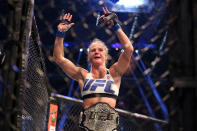 <p>Rousey became a breakthrough, mainstream superstar, but it all came crashing down at UFC 193. A crowd of 56,214 in Melbourne, Australia saw Holly Holm dominate Rousey, then finish her with a head kick in the second round. Rousey fought just once more before fleeing to the safety of the WWE’s scripted fighting. (Photo by Quinn Rooney/Getty Images) </p>