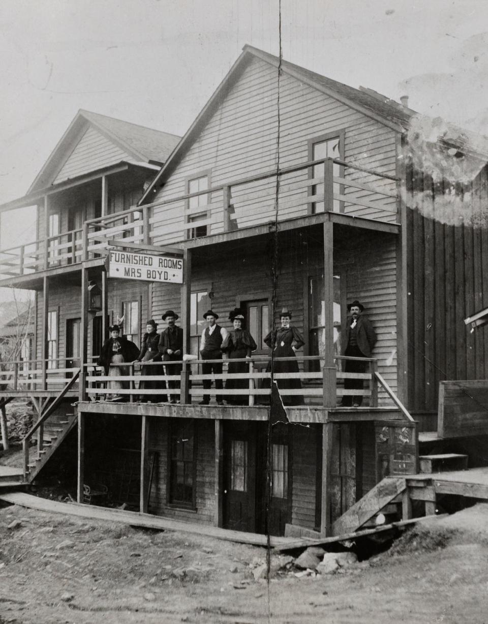 A group of people on a balcony of the St Charles Hotel in Jerome, Arizona, circa 1895.