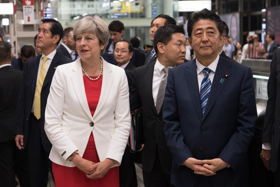 Prime Minister Theresa May with Japan’s Prime Minister, Shinzo Abe, as they arrive at Kyoto Train Station to board a bullet train to Tokyo (Carl Court/Getty Images)