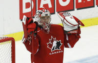 Canada's goalie Zachary Fucale raises his arms after Canada defeated the United States in their IIHF World Junior Championship ice hockey game in Malmo, Sweden, December 31, 2013. REUTERS/Alexander Demianchuk (SWEDEN - Tags: SPORT ICE HOCKEY)